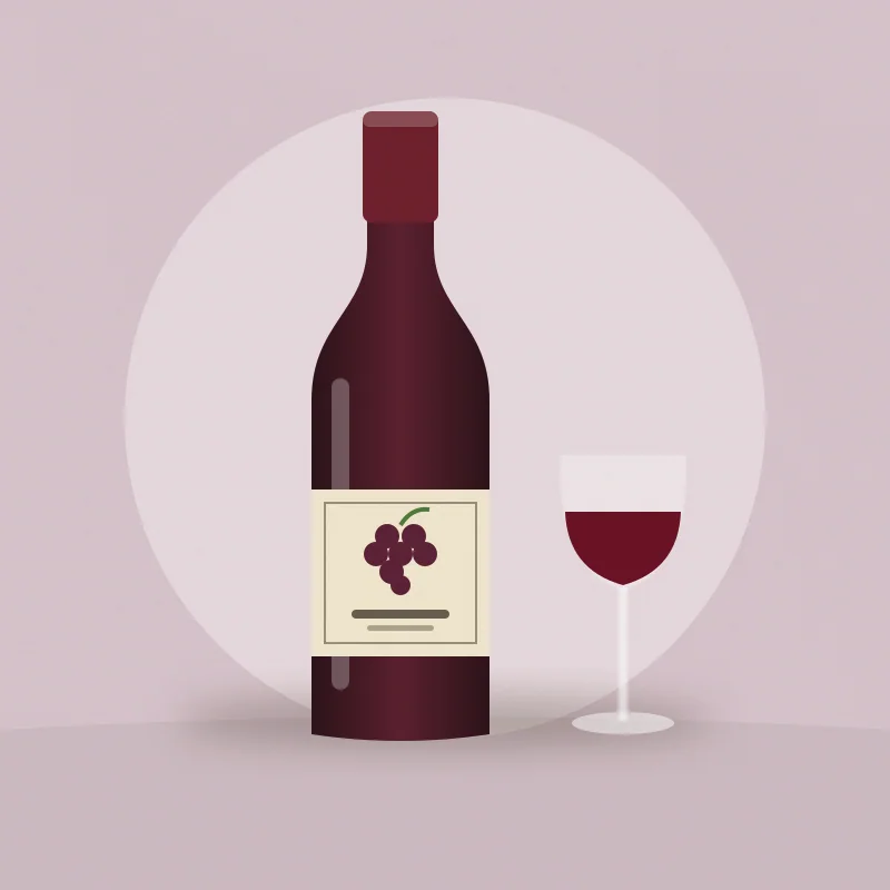 Botella de vino tinto con etiqueta de uvas y una copa servida al lado